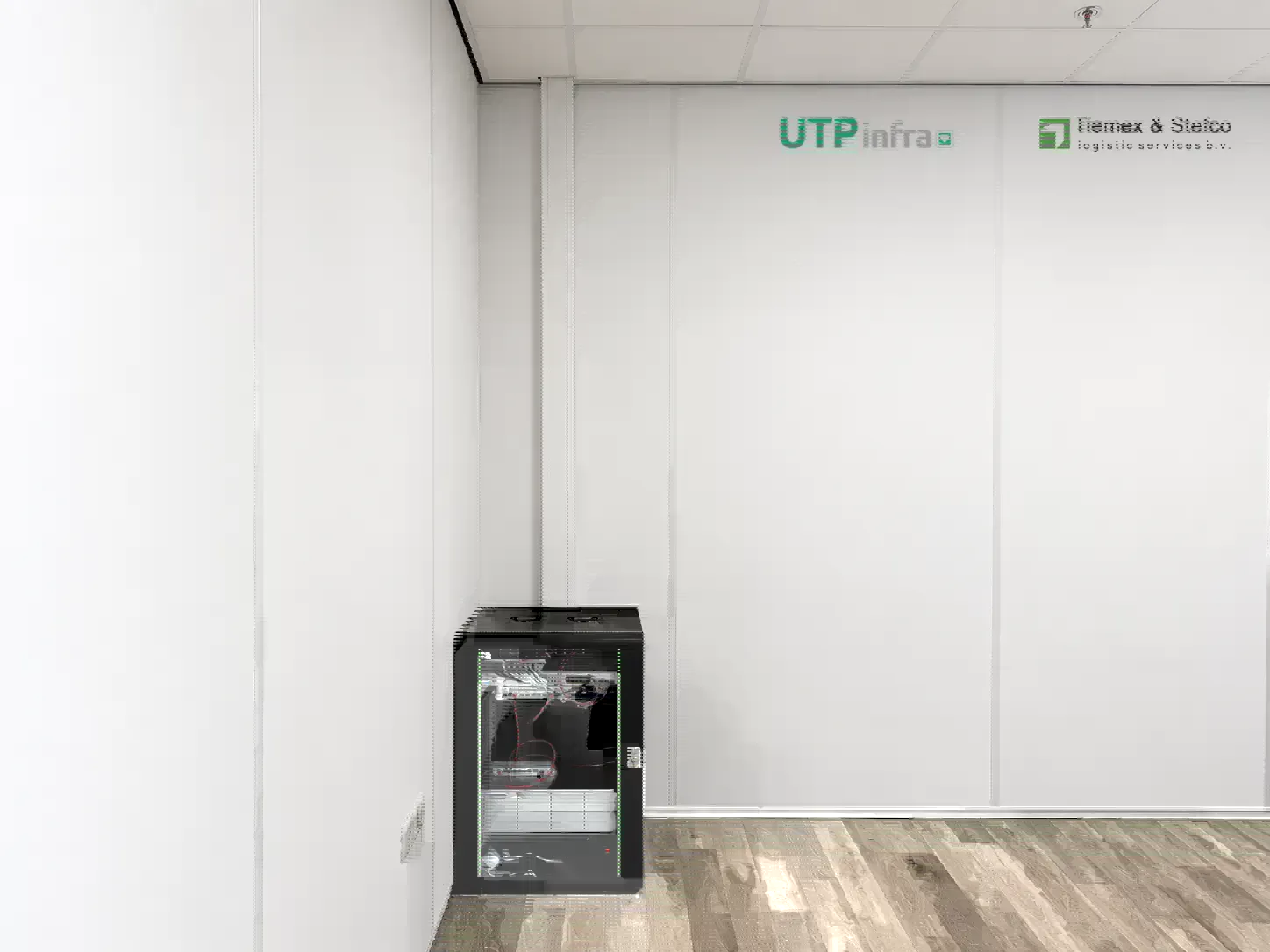Wall-mounted cabinet install at Tiemex with UTPinfra branding